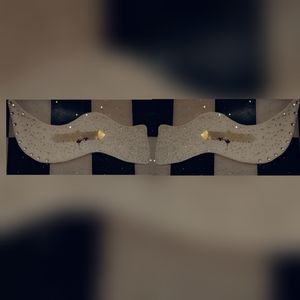 Wings sculpture designed with mirrors and jewelrie